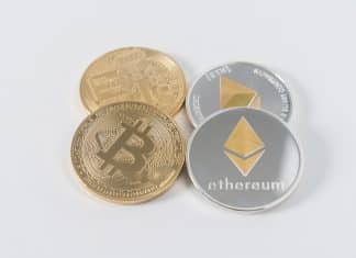 four round silver-colored and gold-colored Bitcoins