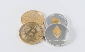 four round silver-colored and gold-colored Bitcoins