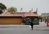 woman walking towards McDonald's branch during daytime