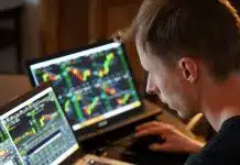 man sitting in front of the laptop