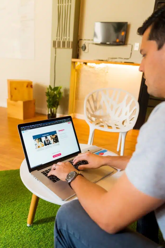 person in white shirt using macbook air